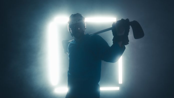Portrait,Of,Caucasian,Male,Ice,Hockey,Player,In,Uniform,,Looking