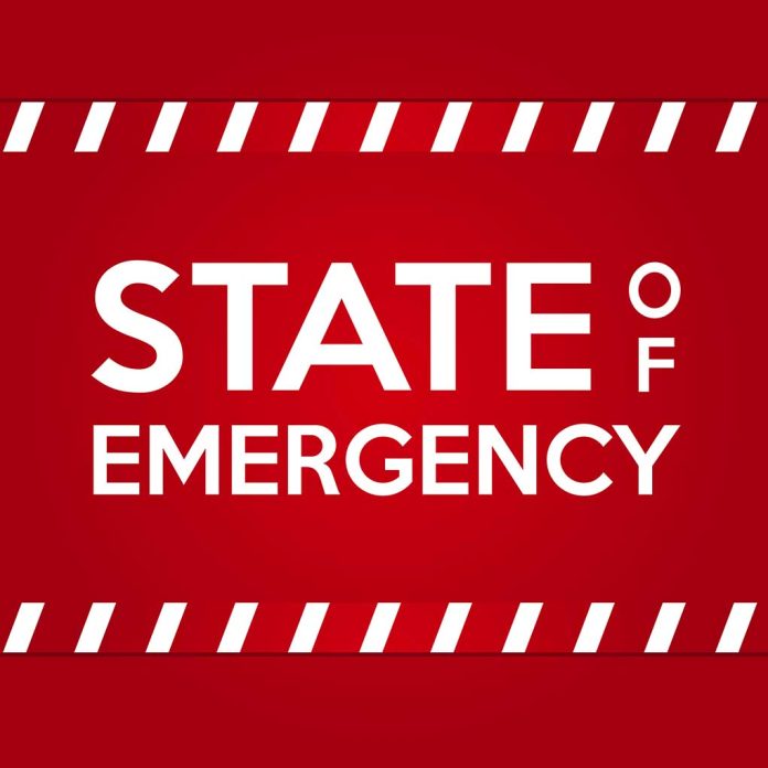 State,Of,Emergency,Banner.,White,Text,On,Red,Background,With
