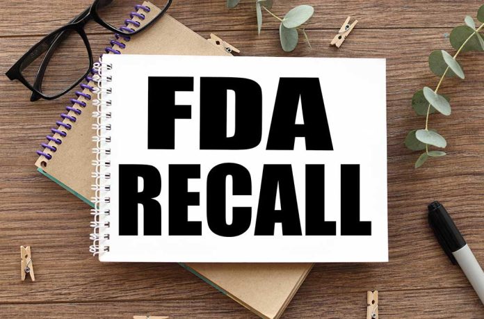 Fda,Recall.,Text,On,White,Paper,Over,Torn,Paper,Background.