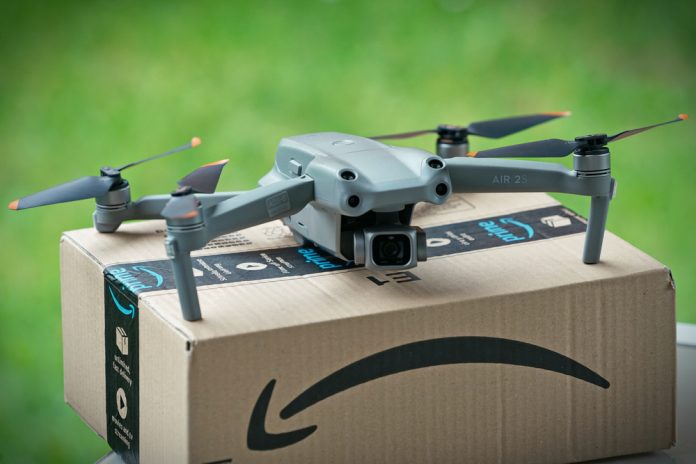 Selective,Focus,On,Drone,Delivering,Parcel,With,Amazon,Logo,On