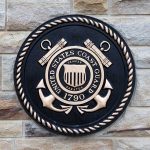 US Coast guard insignia on brick wall