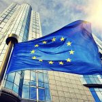European Union flag in front of an office building
