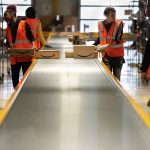 several young people working in a fulfillment center