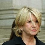 Martha Stewart in front of a column