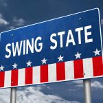 "Swing State" sign with stars and stripes design.