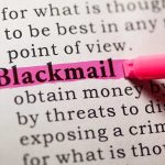 dictionary definition of blackmail in pink highlighter