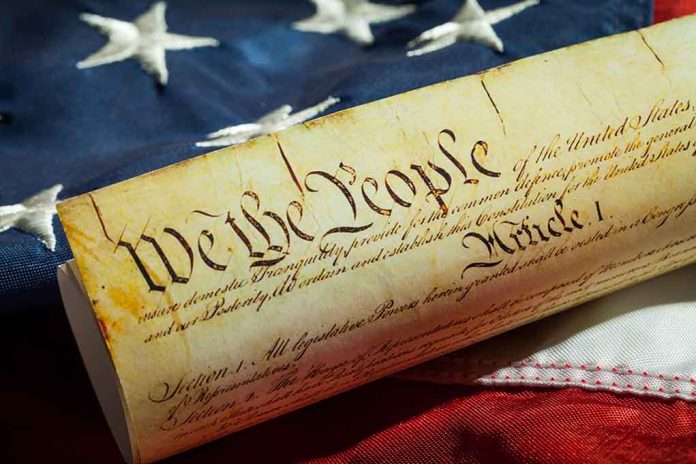290018204 featured image U.S. Constitution with American flag background.