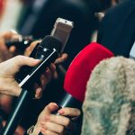 reporters with microphones