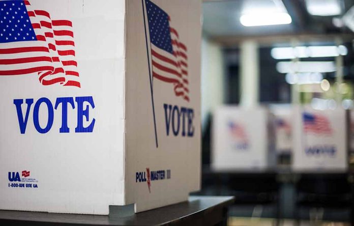1837302940 featured image Voting booths with American flags and "Vote" signs.