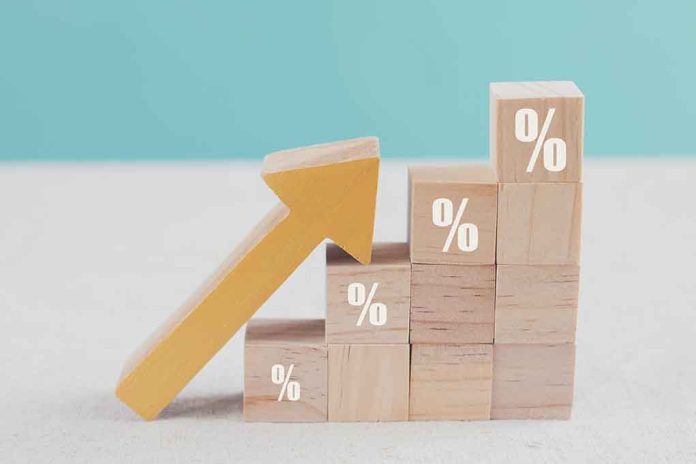 1940609209 featured image Arrow pointing upward on stacked percentage blocks.
