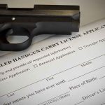 Handgun on concealed carry license application form.