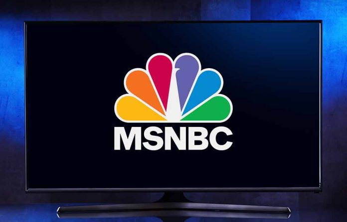 2139067205 featured image TV displaying MSNBC peacock logo on screen.