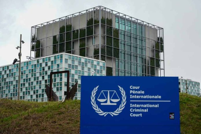 2412227789 featured image International Criminal Court building with sign in foreground.