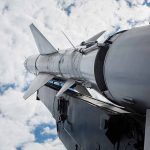 Sky surface-to-air missile rocket tilting upwards.