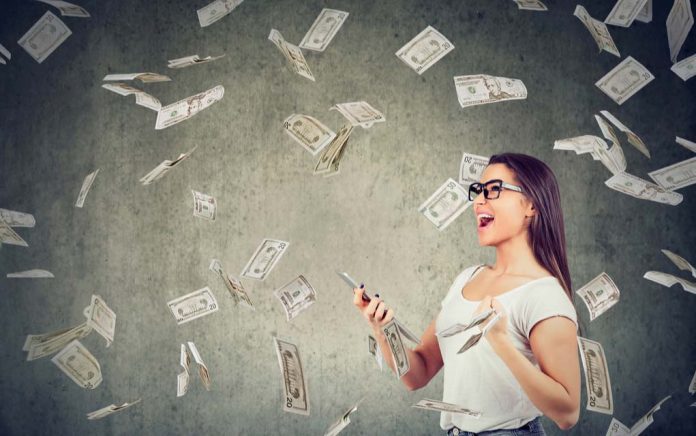 1336971044 featured image Woman with smartphone surrounded by falling money