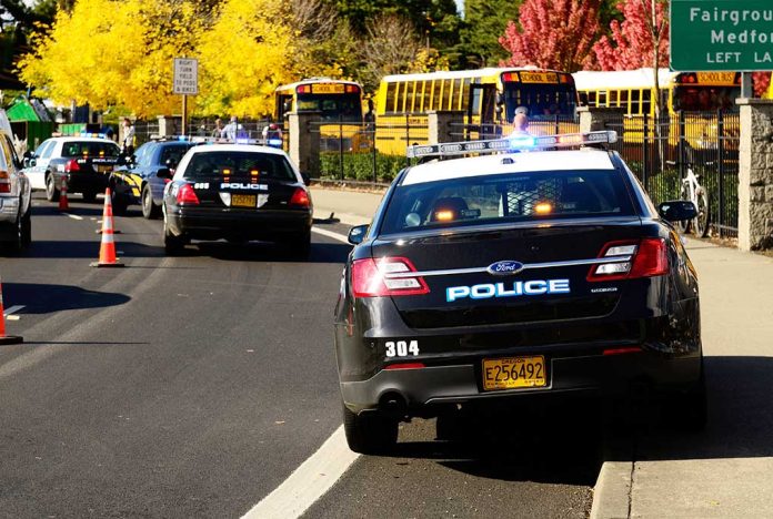 117302929 featured image Police cars and school buses on a road.