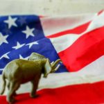 Elephant figurine on the American flag background