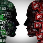 Silhouettes filled with "YES" and "NO" signs facing each other.