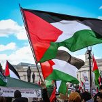 Palestine flags being raised by protestors