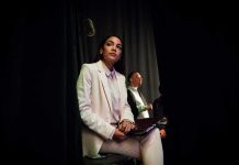 Representative Alexandria Ocasio Cortez in a white suit