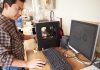 Man standing at a 3d printer