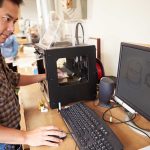 Man standing at a 3d printer