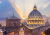 Sunset light behind historic domed cathedral building