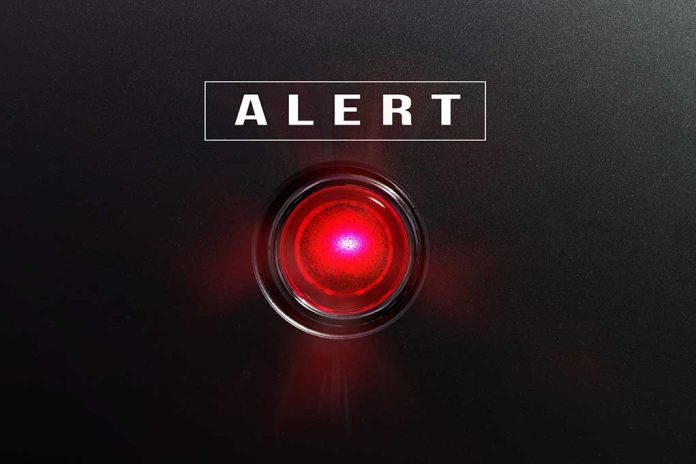 582441490 featured image Red alert button on black background