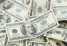 Pile of one hundred dollar bills