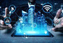 Holographic city above tablet with technology icons
