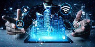 Holographic city above tablet with technology icons