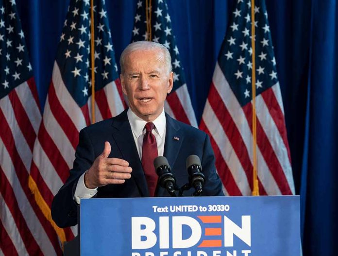 1608793423 featured image Man speaking at podium with American flags behind