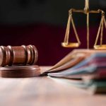 Judges gavel scales of justice and legal documents