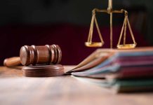 Judges gavel scales of justice and legal documents
