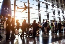 People in line at busy airport terminal