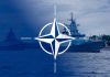 NATO emblem overlaying naval ships in the ocean