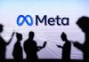 People silhouetted against Meta logo background