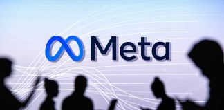 People silhouetted against Meta logo background