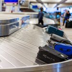 Luggage on airport baggage claim conveyor belt