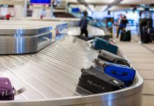Luggage on airport baggage claim conveyor belt