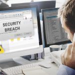 Security breach alert displayed on computer monitor.