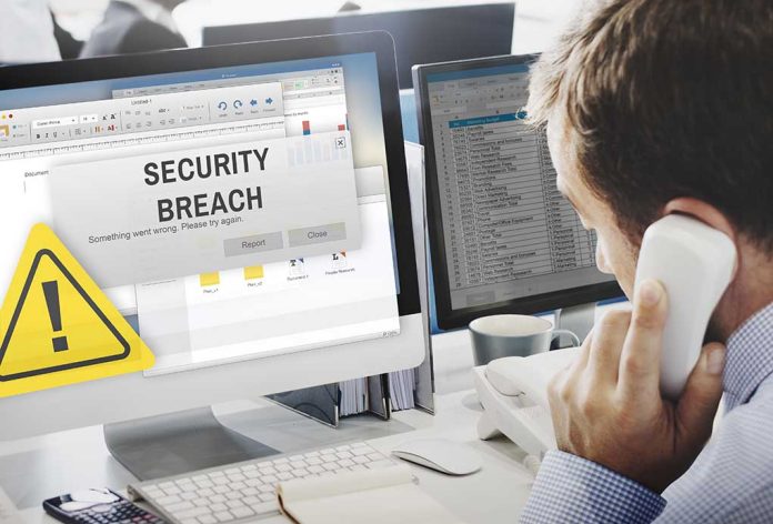 432988318 featured image Security breach alert displayed on computer monitor.