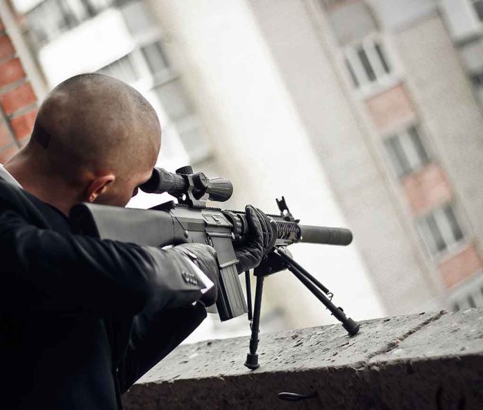 555247681 featured image Person aiming a rifle from a building balcony