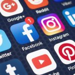 Social media app icons displayed on a smartphone screen.