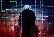 Hooded figure with cybersecurity related words and binary code