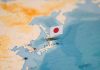 Map of Japan with flag pin placed nearby