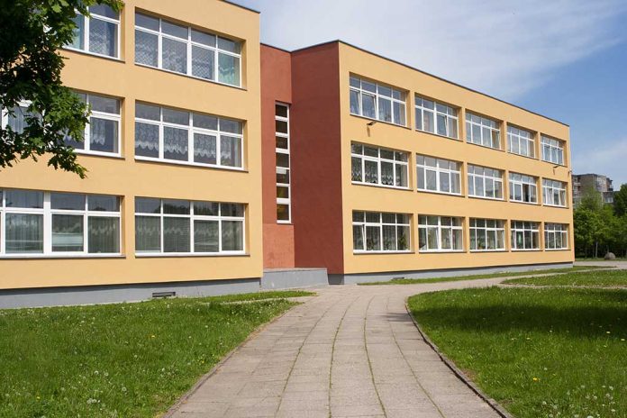 525554962 featured image Threestory yellow building with many windows