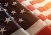 Close up of American flag with sunlit background