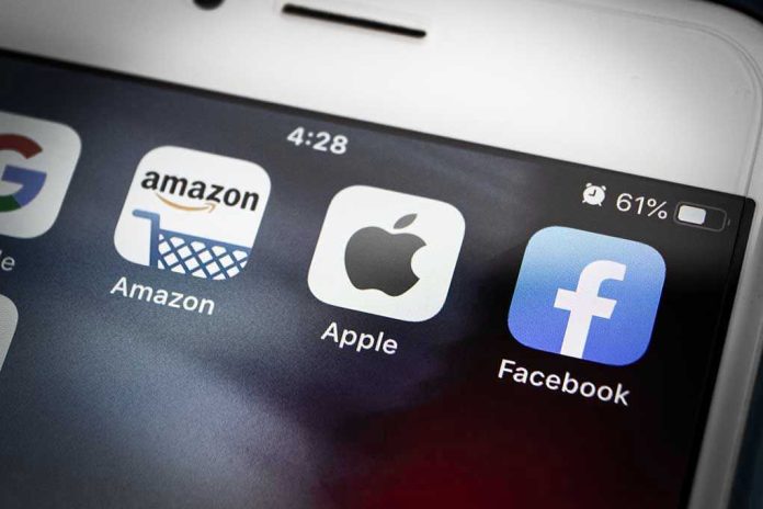 1790828315 Amazon Apple Facebook apps on smartphone screen