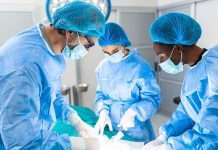 Surgeons performing an operation in a sterile environment.